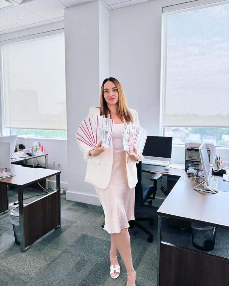 Alina Kats ESQ with Green Cards Envelopes 768x960